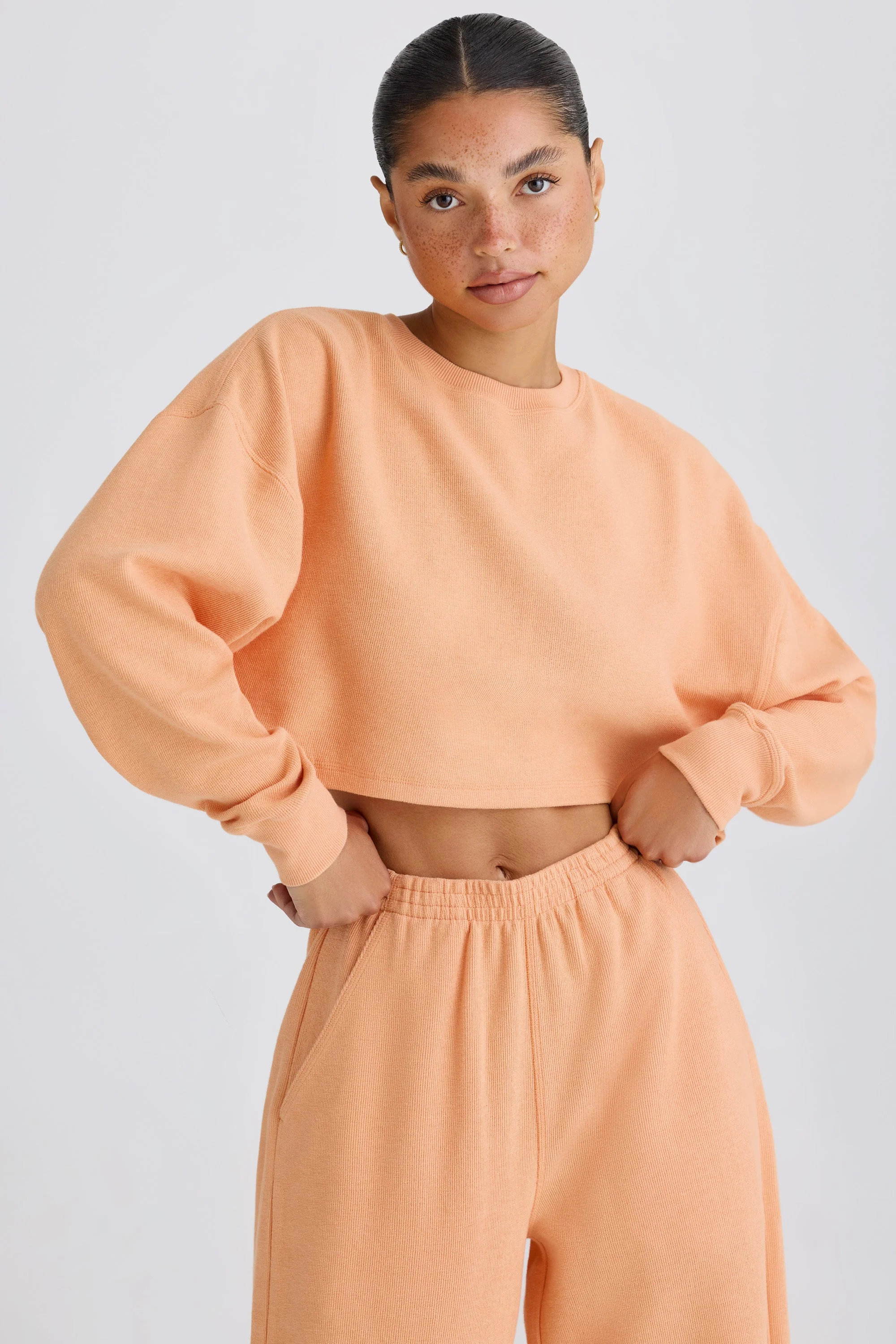 Textured Cotton Jersey Open-Back Cropped Sweatshirt in Peach - Image 5
